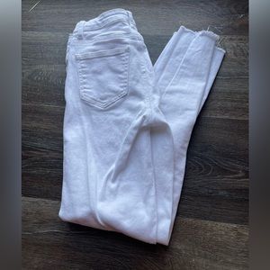 White skinny jeans with fringe on the bottom